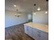 Modern kitchen with island, white cabinets, and quartz countertops at 4062 W Camino Acequia St, Phoenix, AZ 85051