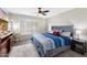 Main bedroom with king-size bed and window shutters at 4421 W Laurie Ln, Glendale, AZ 85302