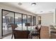 Bright dining area with glass table and pool view at 4421 W Laurie Ln, Glendale, AZ 85302