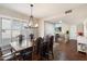 Bright dining room with a view into the living room and hardwood floors at 4421 W Laurie Ln, Glendale, AZ 85302