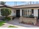 House exterior featuring a walkway, landscaping, and a dark brown front door at 4421 W Laurie Ln, Glendale, AZ 85302