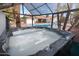 Relaxing hot tub with pool and palm trees in view at 4421 W Laurie Ln, Glendale, AZ 85302