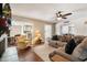 Living room with hardwood floors and a view of the kitchen and dining areas at 4421 W Laurie Ln, Glendale, AZ 85302