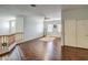 Loft bedroom with hardwood floors and double doors at 46107 W Morning View Ln, Maricopa, AZ 85139