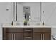 Double vanity bathroom with modern dark brown cabinets and quartz countertop at 4717 S Ferric --, Mesa, AZ 85212