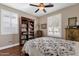 Serene bedroom with bookcase and window seating area at 5089 S Harvest St, Gilbert, AZ 85298