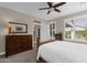 Charming bedroom with wooden dresser and plenty of natural light at 5089 S Harvest St, Gilbert, AZ 85298