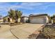 Single-story home with a two-car garage and nicely landscaped yard at 5089 S Harvest St, Gilbert, AZ 85298