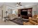 Bright living room with comfortable seating and large windows at 5089 S Harvest St, Gilbert, AZ 85298