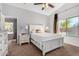 Primary bedroom with white furniture and large window at 509 E Daniella Dr, San Tan Valley, AZ 85140