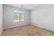 Small bedroom with large window and carpeted floor at 509 E Daniella Dr, San Tan Valley, AZ 85140