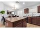 Kitchen island with seating and a view of the dining area at 509 E Daniella Dr, San Tan Valley, AZ 85140