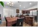 Kitchen with dark wood cabinets and an island at 509 E Daniella Dr, San Tan Valley, AZ 85140