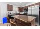 Kitchen with island and stainless steel appliances at 509 E Daniella Dr, San Tan Valley, AZ 85140