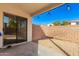 Covered patio with a gravel yard and block wall at 509 E Daniella Dr, San Tan Valley, AZ 85140