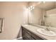 Double vanity bathroom with modern dark brown cabinets at 5450 E Deer Valley Dr # 1180, Phoenix, AZ 85054