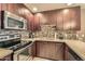 Modern kitchen with stainless steel appliances and tile backsplash at 5450 E Deer Valley Dr # 1180, Phoenix, AZ 85054