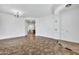 Dining room with tile floor, chandelier, and kitchen view at 6229 S Moccasin Trl, Gilbert, AZ 85298