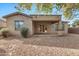 Back exterior view, showing patio and landscaping at 6229 S Moccasin Trl, Gilbert, AZ 85298