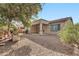 View of backyard and house exterior at 6229 S Moccasin Trl, Gilbert, AZ 85298