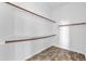 Large walk-in closet with built-in shelving and hanging rods at 6229 S Moccasin Trl, Gilbert, AZ 85298