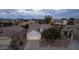 Aerial view of house and neighborhood at dusk at 6497 S Twilight Ct, Gilbert, AZ 85298