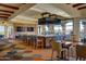 Modern bar with comfortable seating and large screen TVs at 6497 S Twilight Ct, Gilbert, AZ 85298