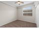 Simple bedroom with carpet, window blinds, and double doors at 6497 S Twilight Ct, Gilbert, AZ 85298