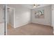 Well-lit bedroom with carpet flooring at 6497 S Twilight Ct, Gilbert, AZ 85298