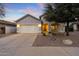 House exterior with a garage and landscaping at 6497 S Twilight Ct, Gilbert, AZ 85298