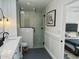 Modern bathroom with a walk-in shower and floating vanity at 7028 N Barbados Pl, Phoenix, AZ 85021