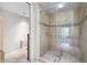 Clean bathroom with a glass enclosed shower and neutral tile at 7175 E Camelback Rd # 207, Scottsdale, AZ 85251