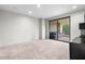 Bright and airy bedroom featuring a sliding door leading to a private balcony at 7175 E Camelback Rd # 207, Scottsdale, AZ 85251