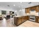 Modern kitchen with granite countertops and wood cabinetry at 7175 E Camelback Rd # 207, Scottsdale, AZ 85251