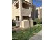 Two-story condo building with light-colored exterior and landscaping at 7510 E Thomas Rd # 134, Scottsdale, AZ 85251