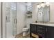 Stylish bathroom with a dark vanity and a walk-in shower at 7705 E Doubletree Ranch Rd # 55, Scottsdale, AZ 85258