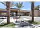 Inviting clubhouse entrance featuring palm trees, black accents, and ample parking at 7705 E Doubletree Ranch Rd # 55, Scottsdale, AZ 85258