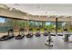 Well-equipped fitness center featuring modern exercise machines and large windows overlooking green spaces at 7705 E Doubletree Ranch Rd # 55, Scottsdale, AZ 85258