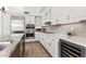 Modern kitchen with white cabinets and granite counters at 7705 E Doubletree Ranch Rd # 55, Scottsdale, AZ 85258