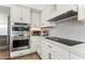 Modern kitchen with stainless steel appliances and white cabinets at 7705 E Doubletree Ranch Rd # 55, Scottsdale, AZ 85258