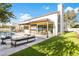 Lush backyard with a pool, outdoor seating, and modern architecture, designed for relaxation and enjoyment at 8255 E Morgan Trl, Scottsdale, AZ 85258