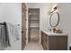 Elegant bathroom featuring modern vanity with granite countertop, sleek faucet, and well-lit mirror at 8255 E Morgan Trl, Scottsdale, AZ 85258