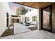 Open-air courtyard featuring an outdoor seating area, modern design, and sleek finishes at 8255 E Morgan Trl, Scottsdale, AZ 85258