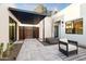 Serene courtyard featuring a pergola, comfortable seating, and modern landscaping, creating a relaxing outdoor space at 8255 E Morgan Trl, Scottsdale, AZ 85258