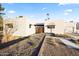 Modern, single-story home with desert landscaping, clean architectural lines, and bright stucco at 8255 E Morgan Trl, Scottsdale, AZ 85258