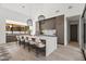 Bright kitchen with quartz countertops, island seating, and modern light fixtures at 8255 E Morgan Trl, Scottsdale, AZ 85258