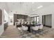 Kitchen island with seating and dining area with modern pendant lighting at 8255 E Morgan Trl, Scottsdale, AZ 85258