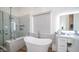 Elegant bathroom with soaking tub, walk-in shower, and modern vanity at 8277 E Tailspin Ln, Scottsdale, AZ 85255