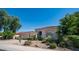 Single-story home with a two-car garage and landscaped yard at 8277 E Tailspin Ln, Scottsdale, AZ 85255