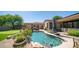 Inviting kidney-shaped pool with ample lounge space at 8277 E Tailspin Ln, Scottsdale, AZ 85255